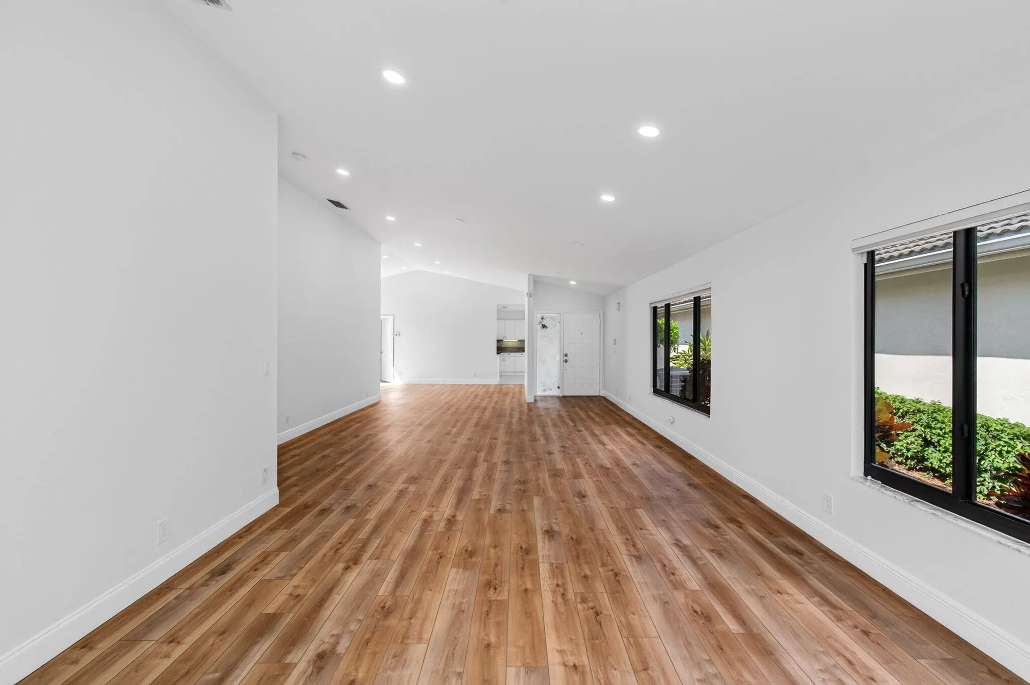 View from Back of Home to Foyer & Kitchen