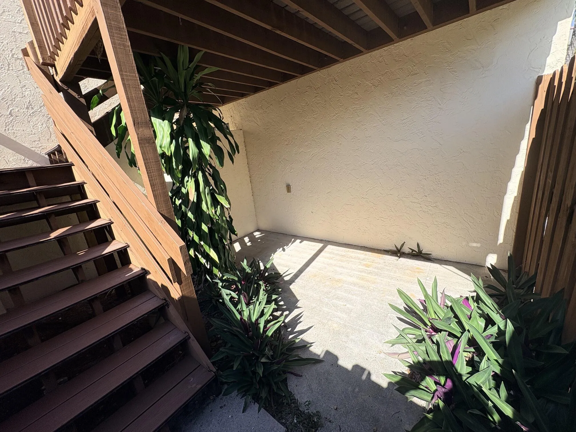 YOUR GATE OPENS UP TO 1st FLOOR COURTYARD WITH STAIRS.