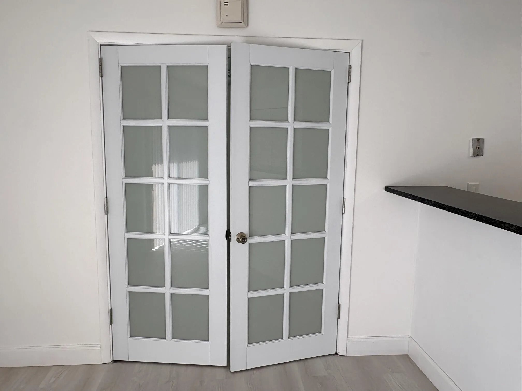 FRENCH DOOR OPEN TO MASTER BEDROOM