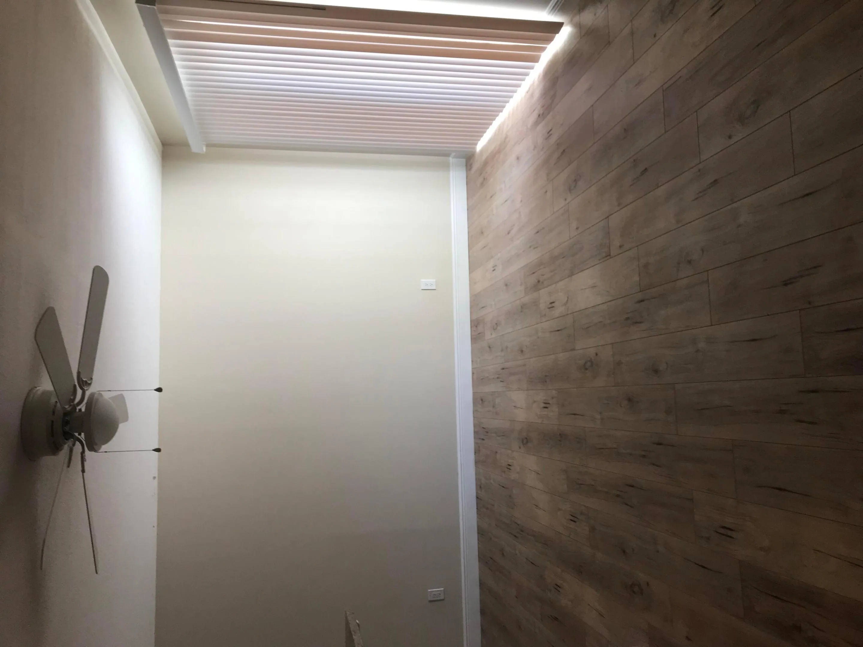 BEDROOM WITH LIVING ROOM BEYOND