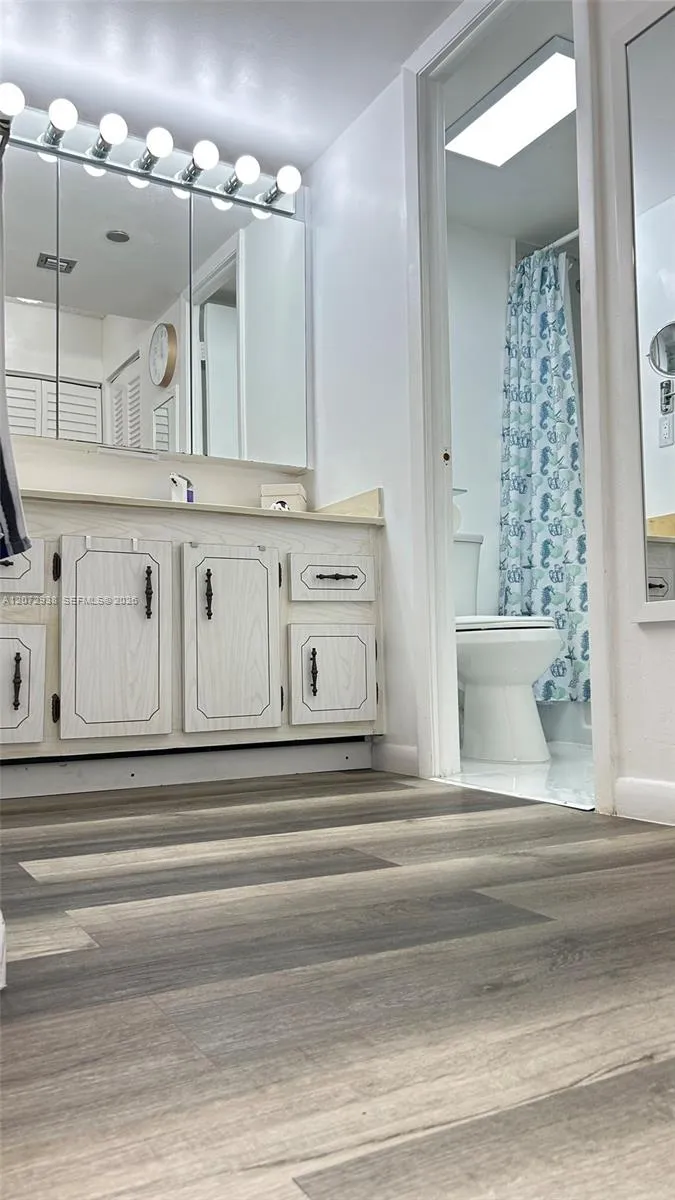 Vanity separate from shower and toilet.