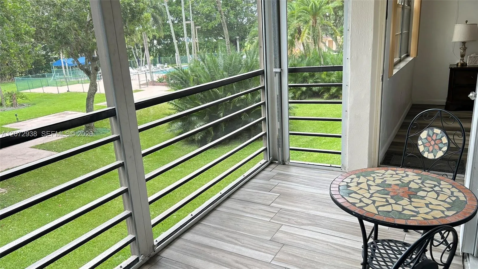with view of the pool and garden