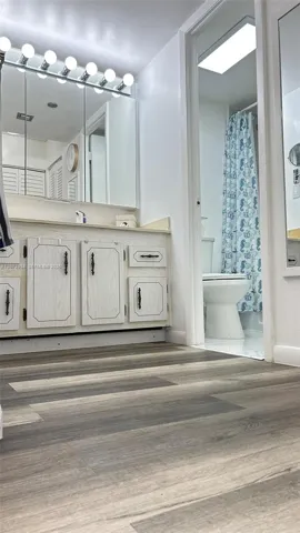 Vanity separate from shower and toilet.
