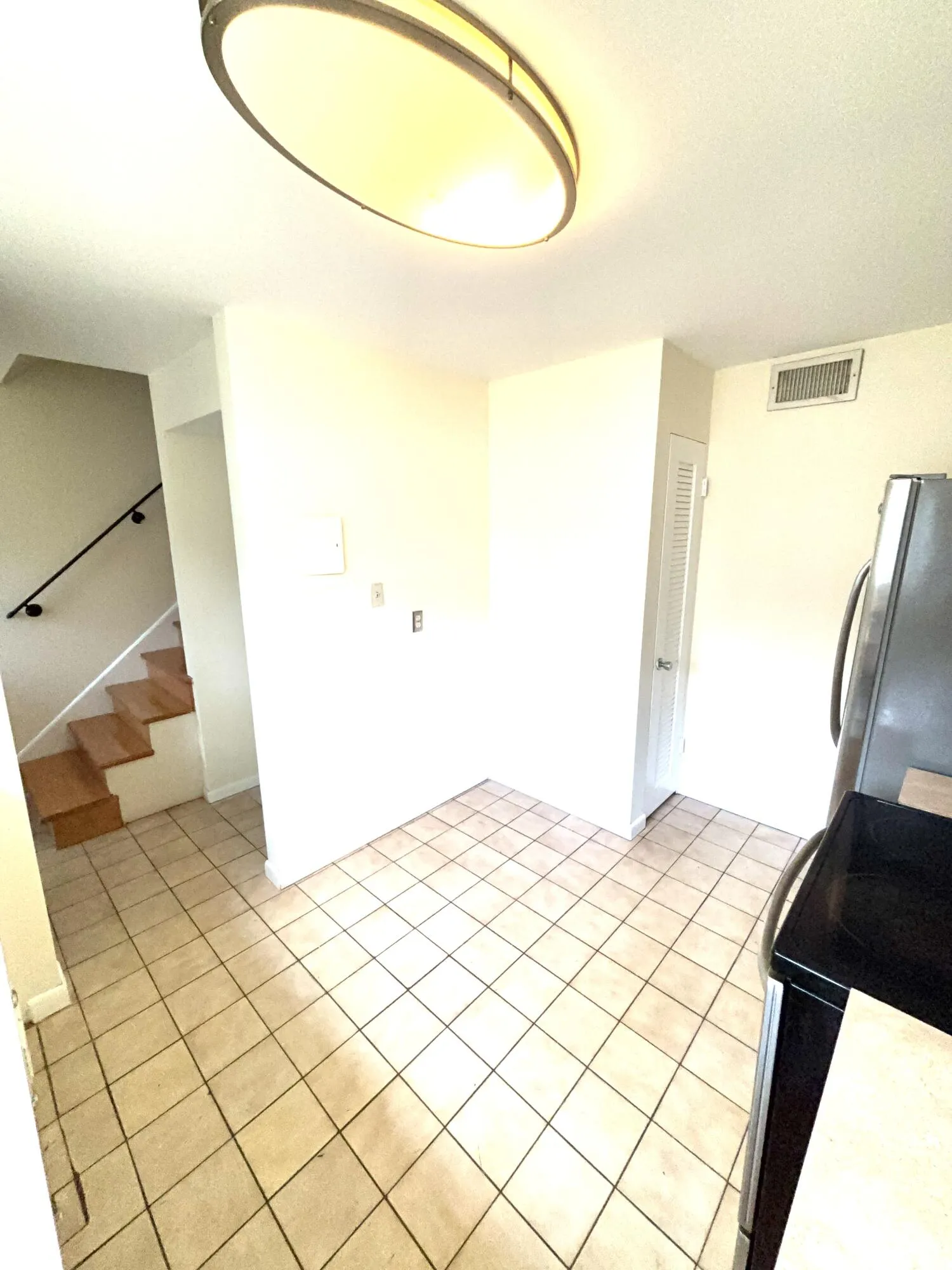 kitchen facing hallway and entrance