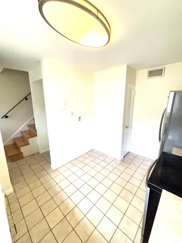 kitchen facing hallway and entrance