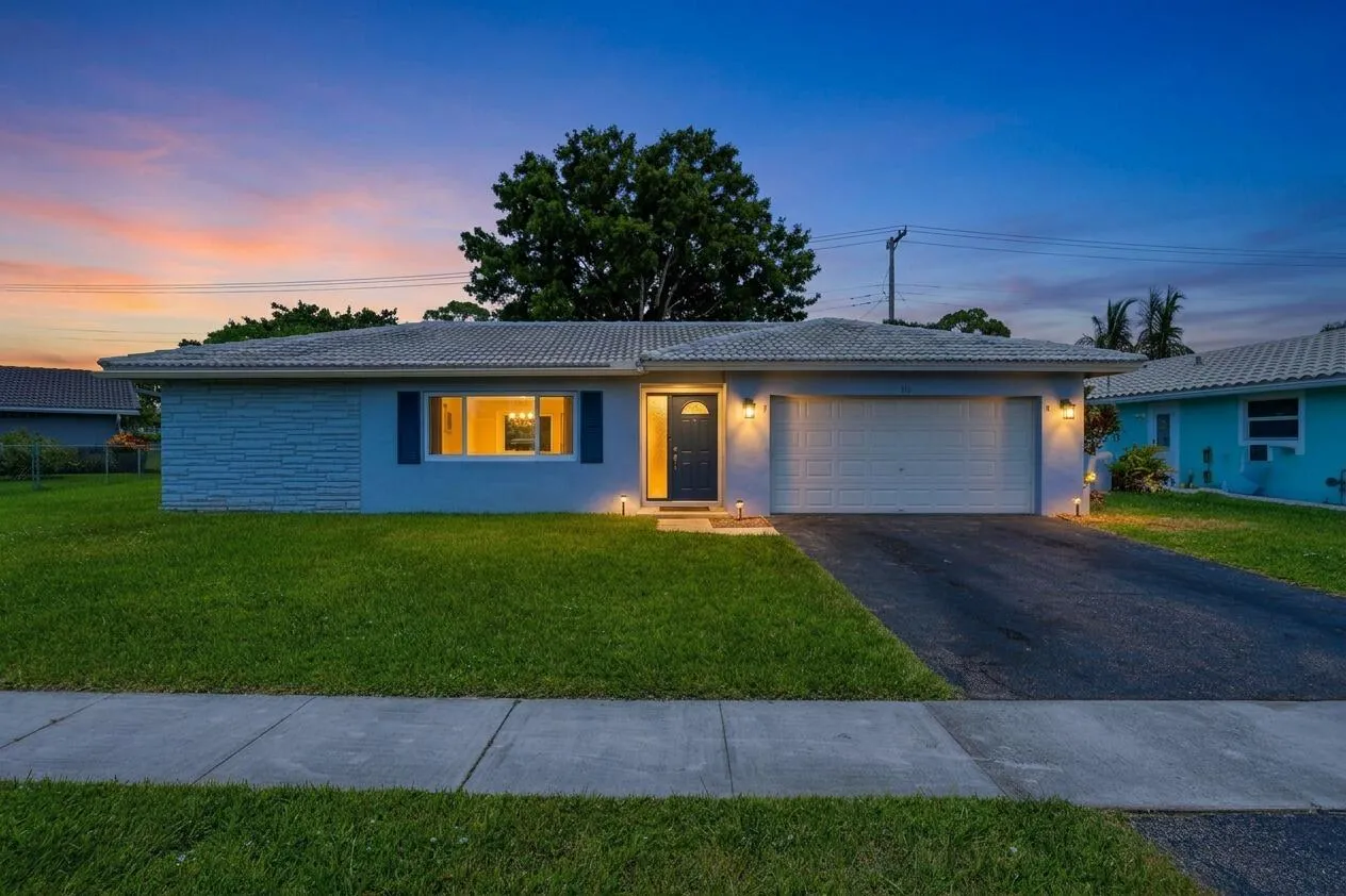 Twilight front of house (virtually staged for illustrative purposes; no permanent features or finishes have been altered)