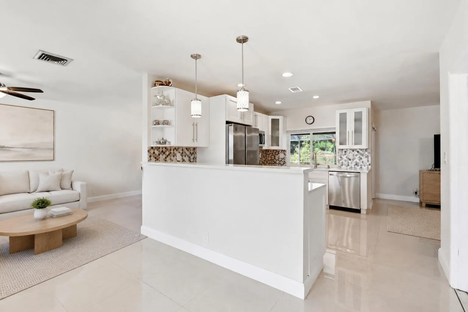 Kitchen centers the home. (virtually staged for illustrative purposes; no permanent features or finishes have been altered)