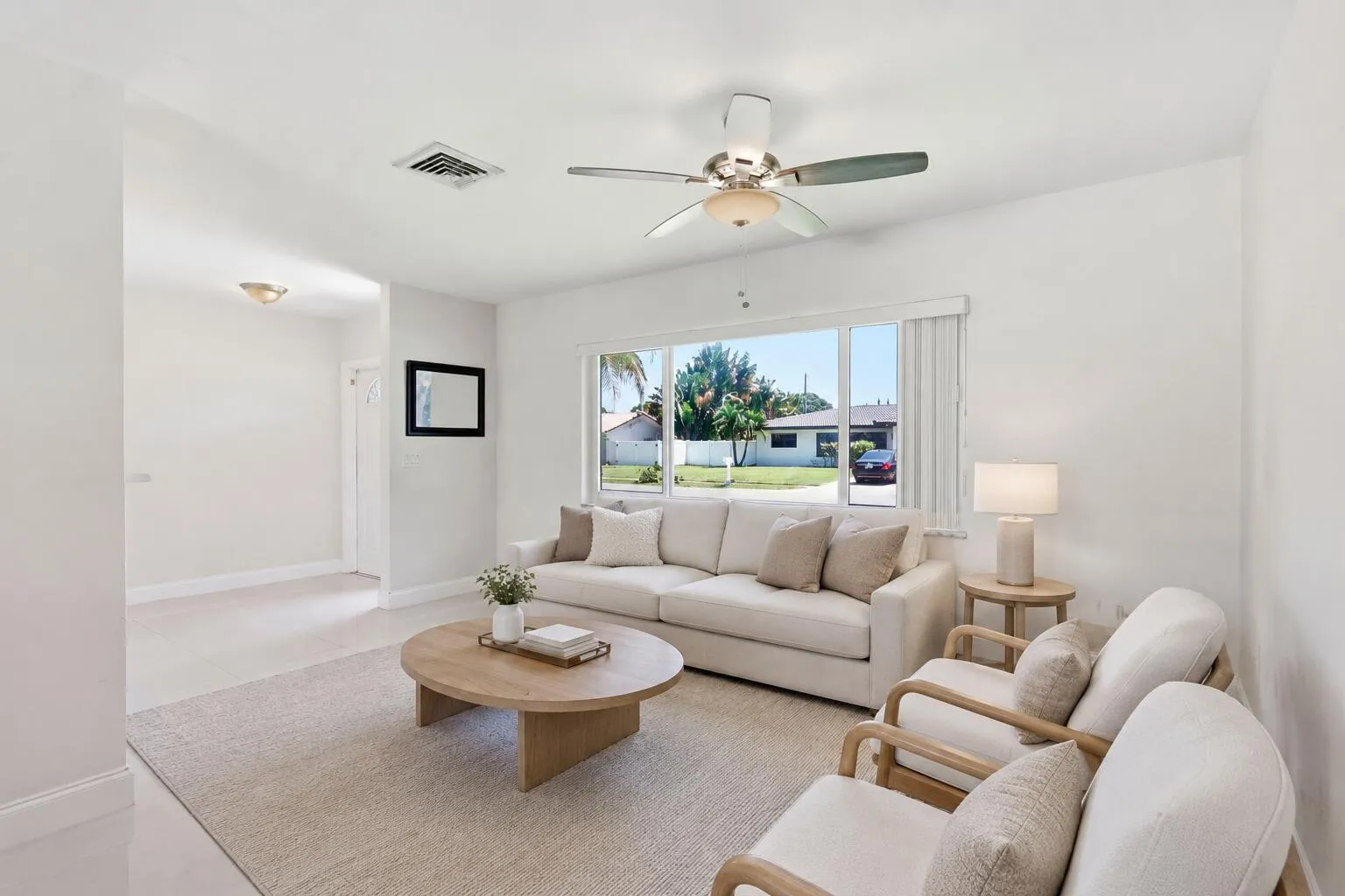Front Entry and Living Room (virtually staged for illustrative purposes; no permanent features or finishes have been altered)