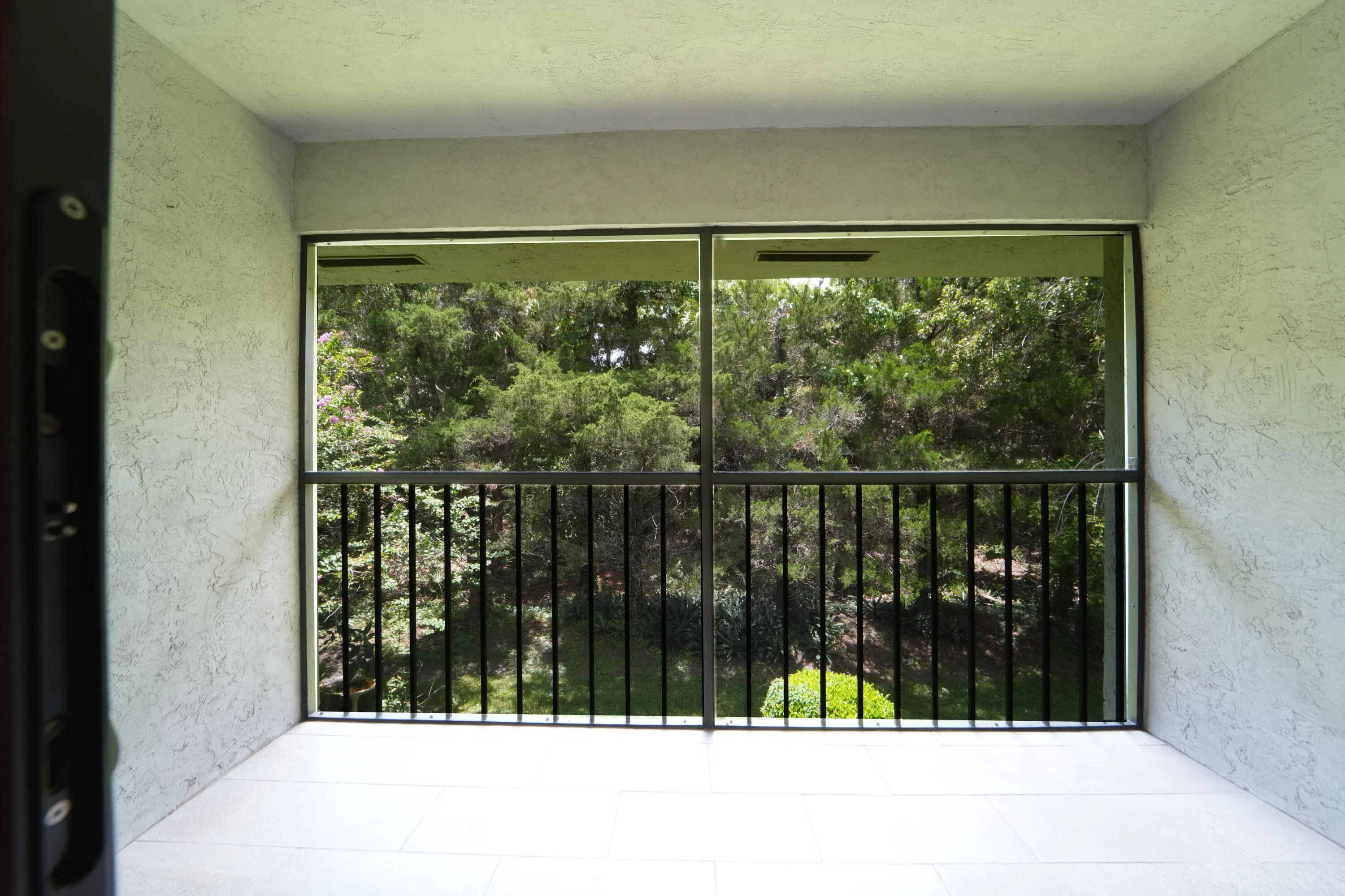 Covered & Screened Back Patio w/ quiet preserve views.