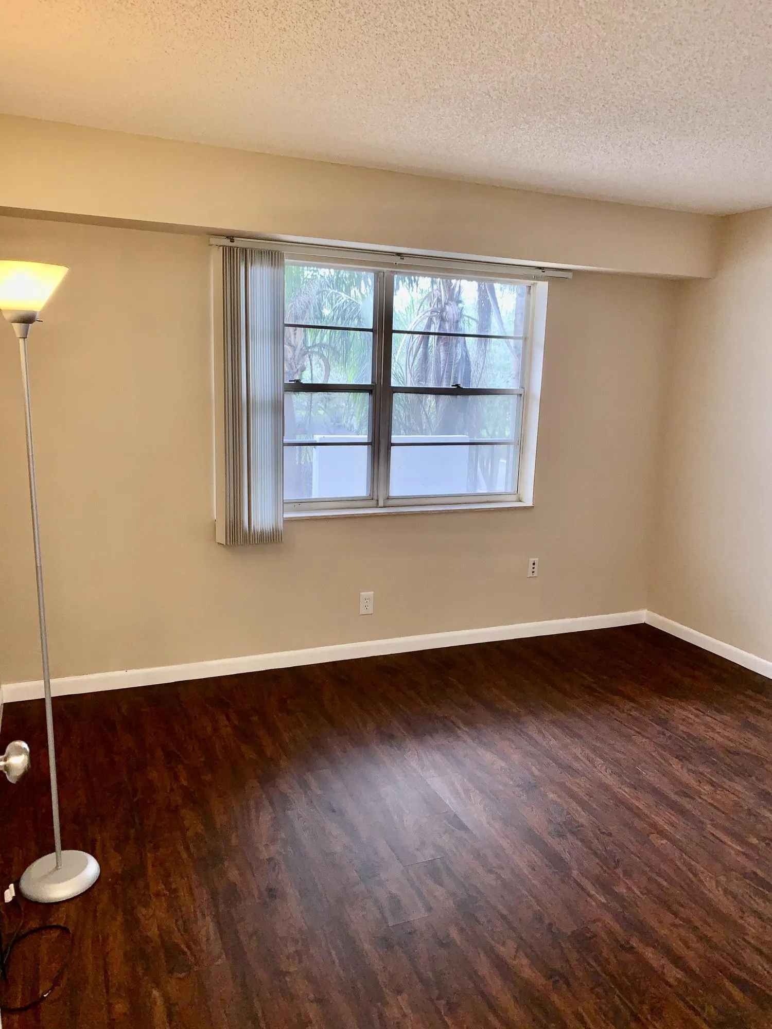 Neutral-toned walls complement wood-finish flooring
