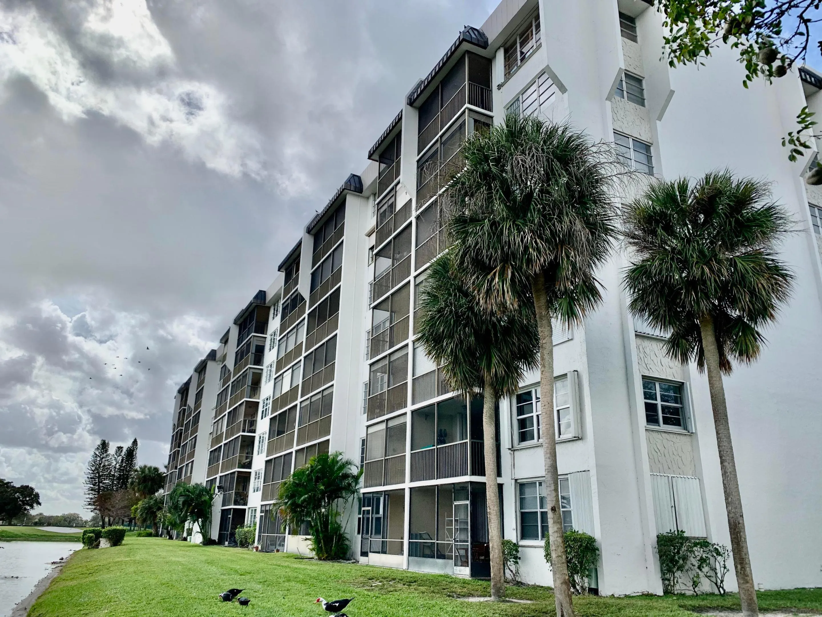 Multi-story building featuring white exterior siding