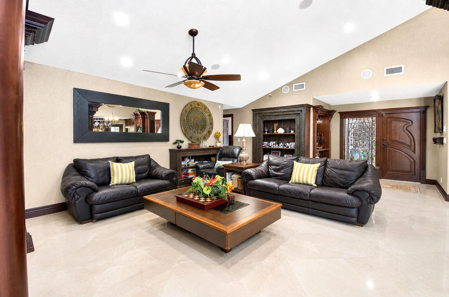 Expansive living areas with soaring ceilings and gorgeous porcelain flooring in living areas.