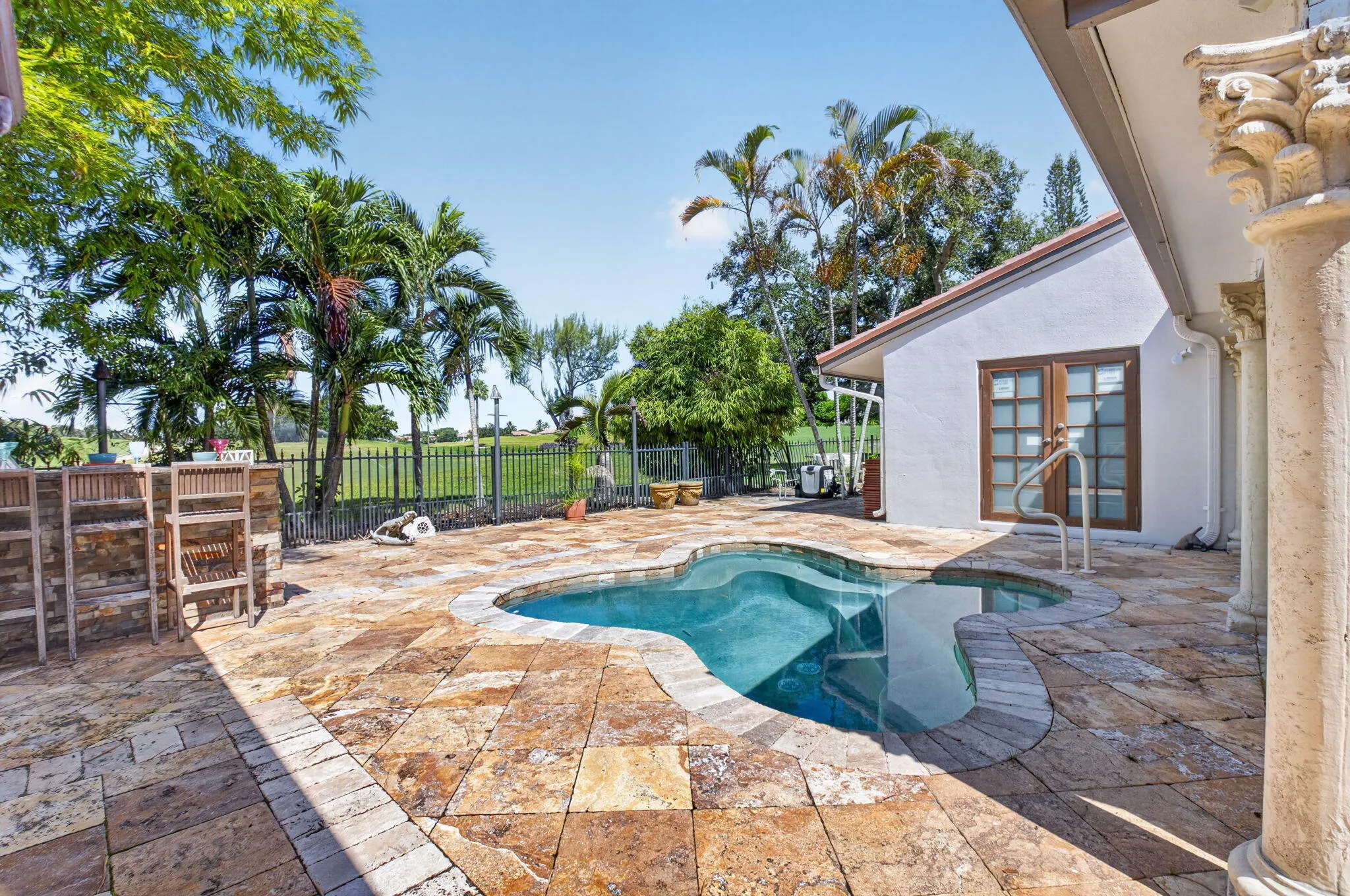 Pool patio and summer kitchenoverlooking the manicured greens. Party like a rock star.