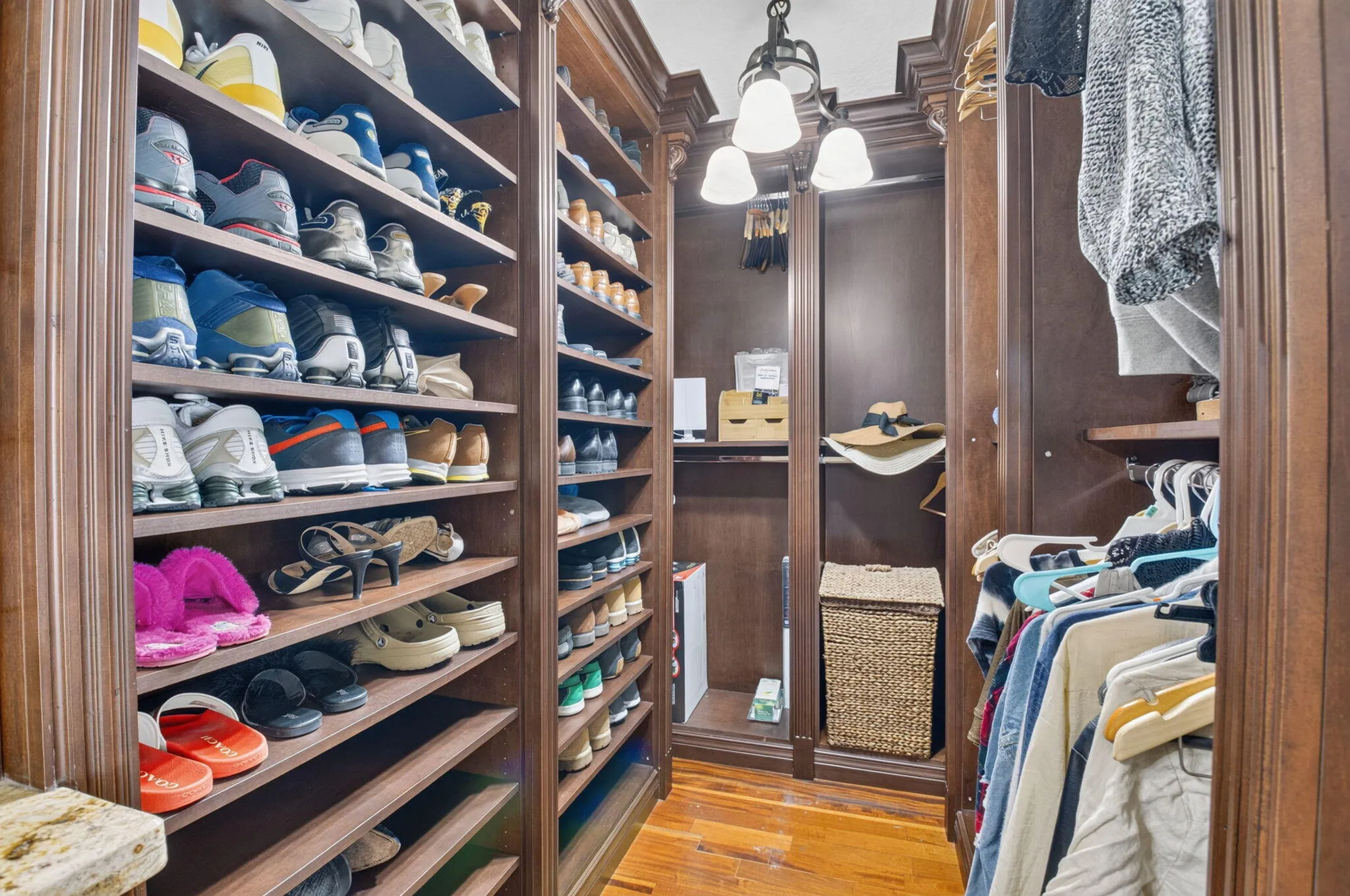 Walk in closet with build out is perfect for fashion fans!