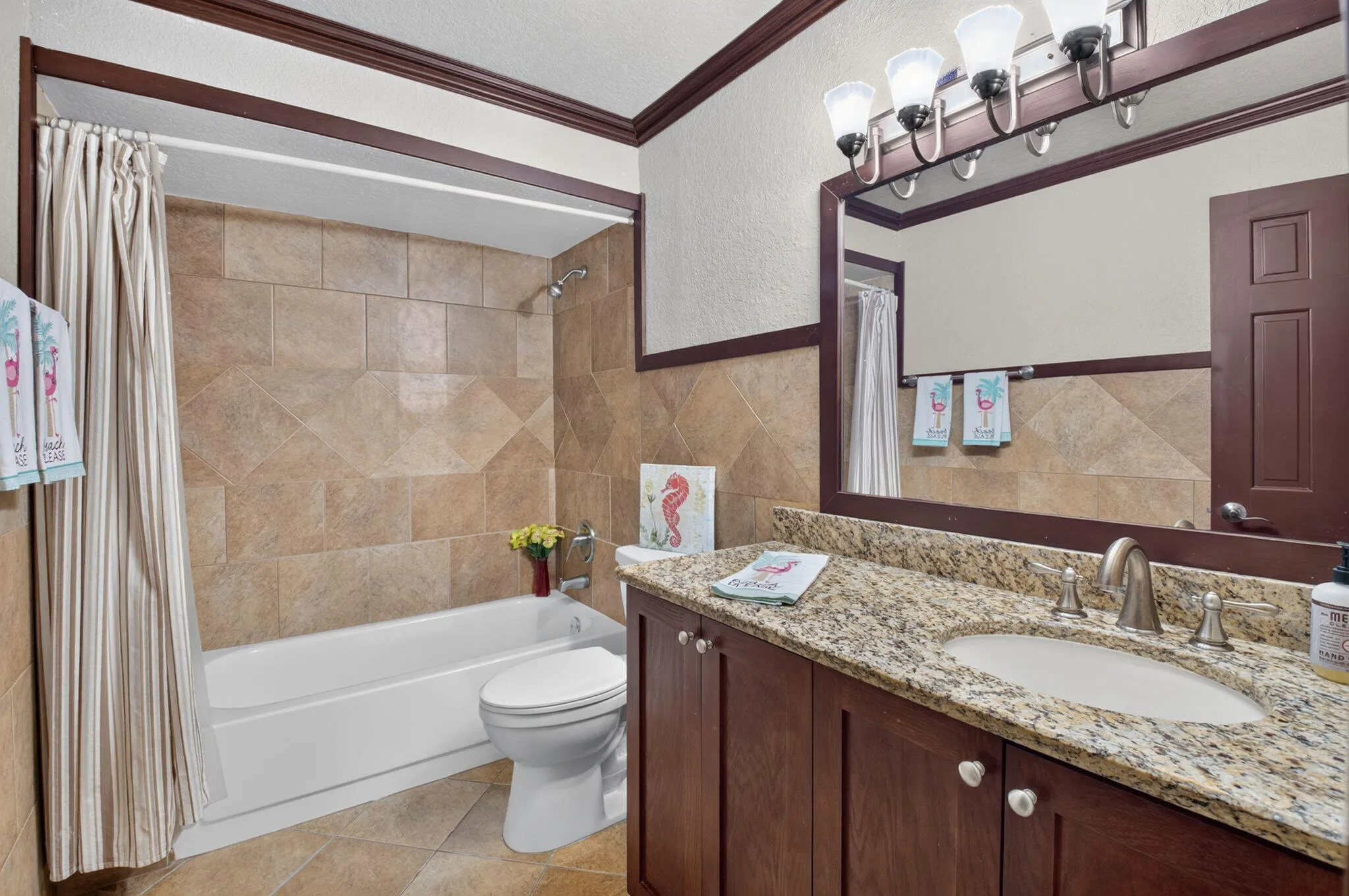 Guest bath with counter height vanity, undermount sink and granite counter. Soak away your worries.