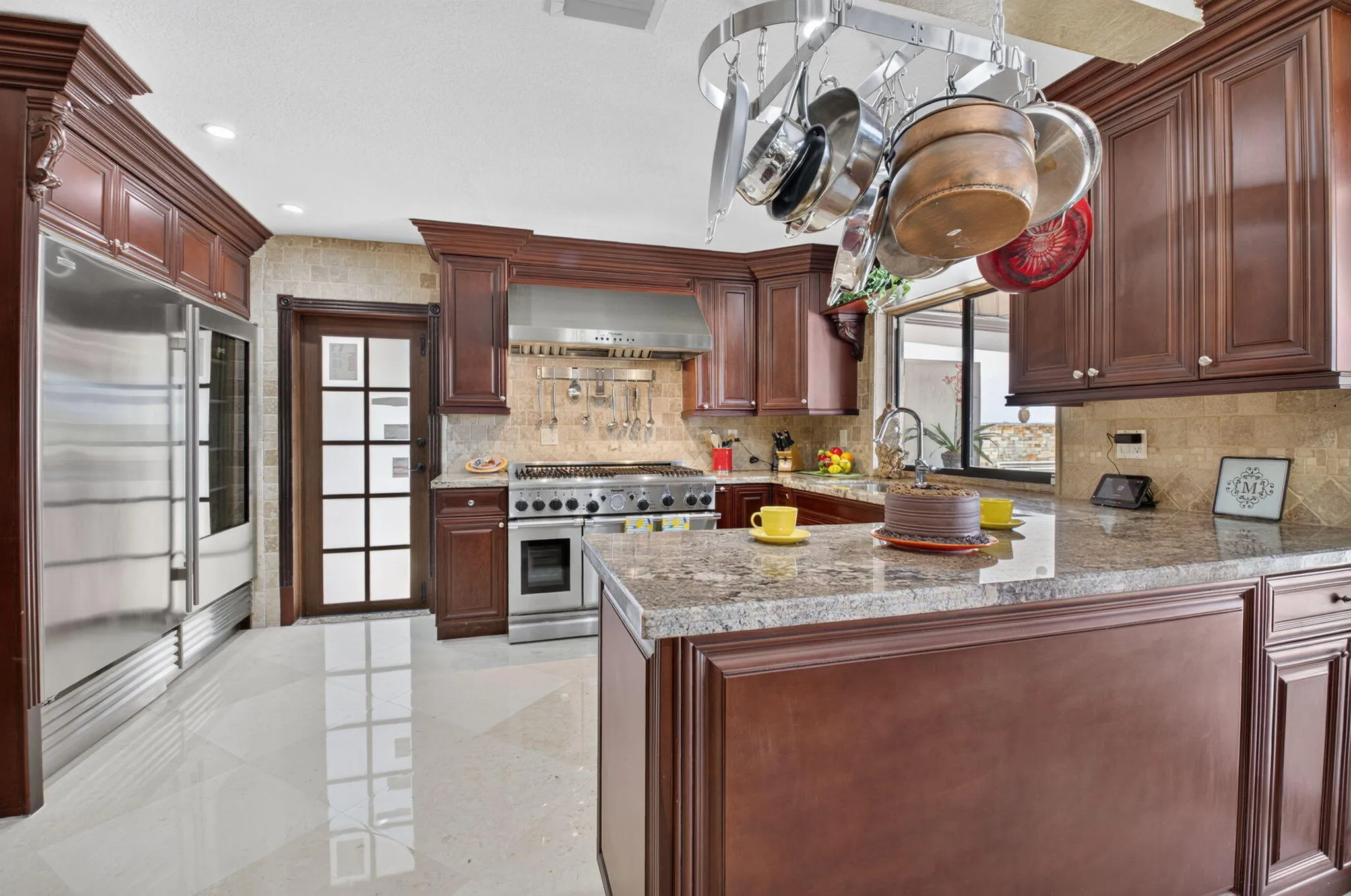 Chef inspired kitchern features substantial custom cabinerty.