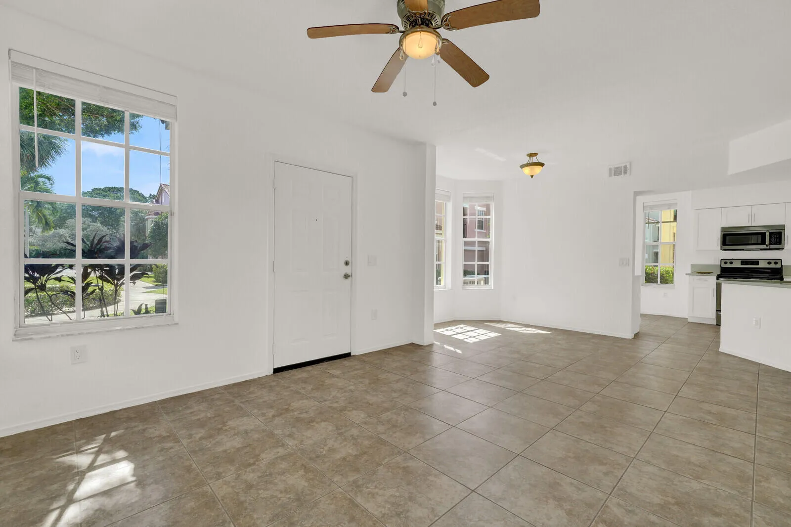 Light floods into the Living room and Kitchen with private patio