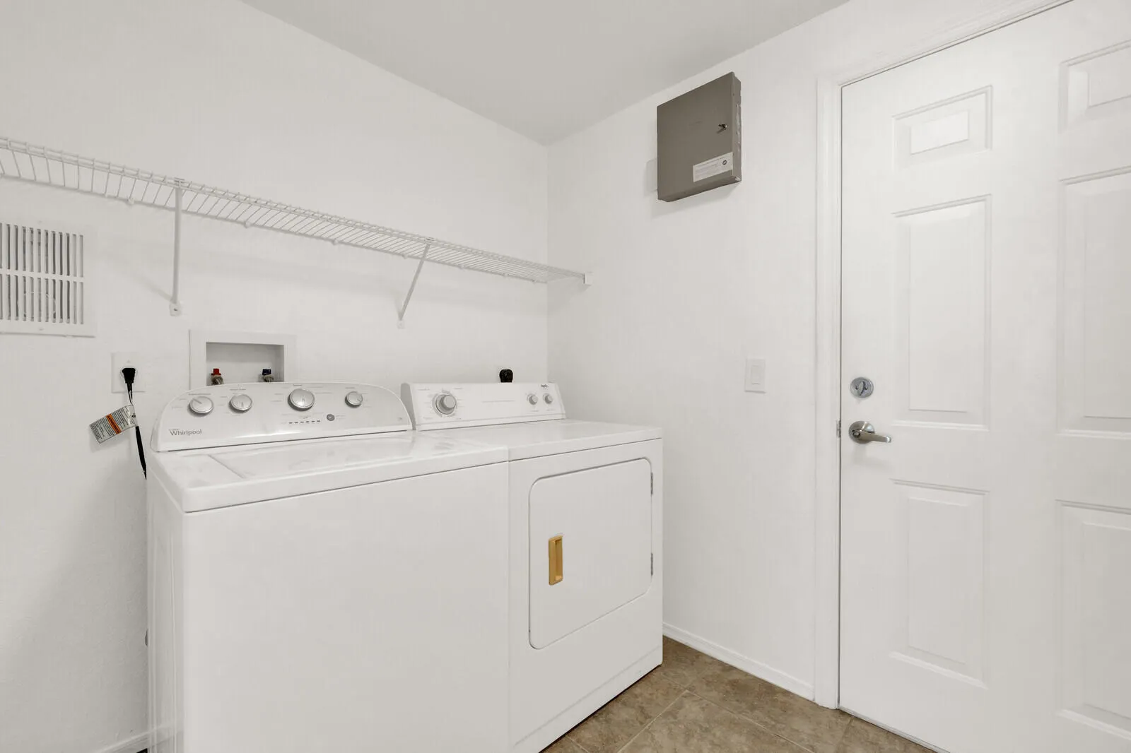 washer and dryer in laundry full sized