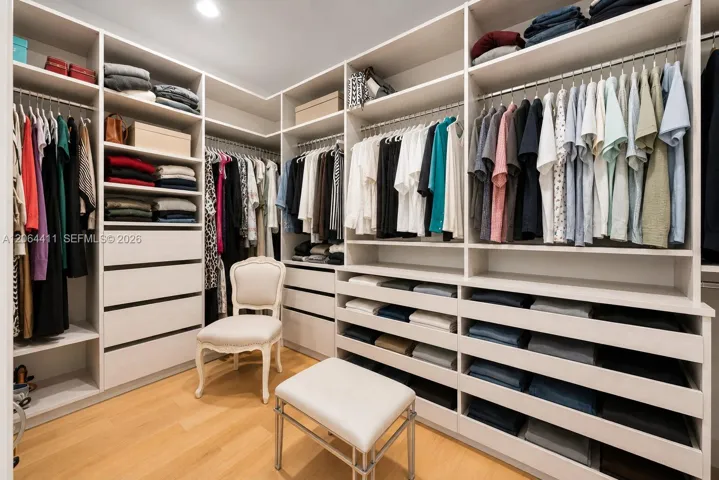 Primary bedroom walk-in closet