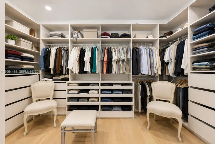 Primary bedroom walk-in closet