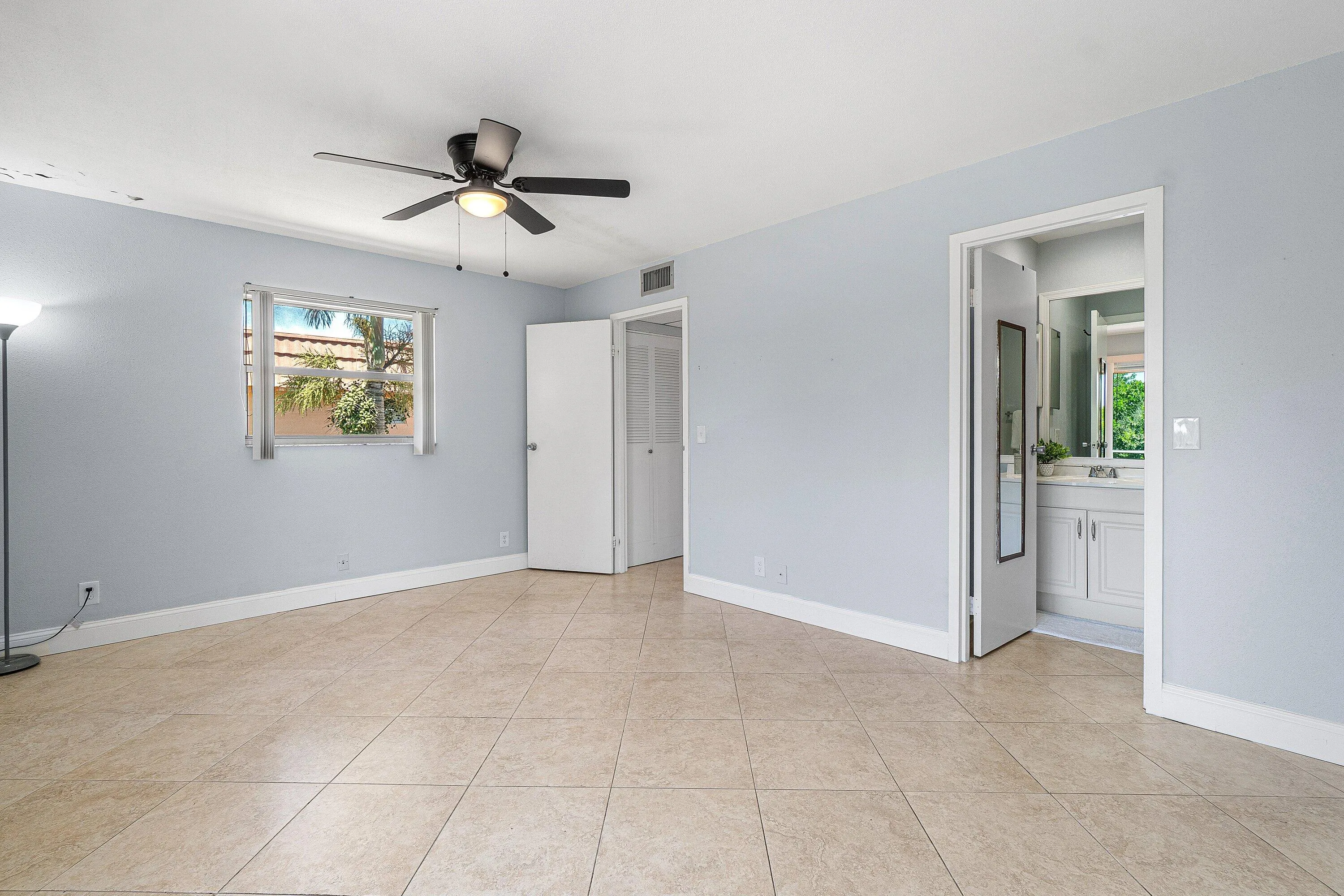 Neutral-toned tile flooring throughout