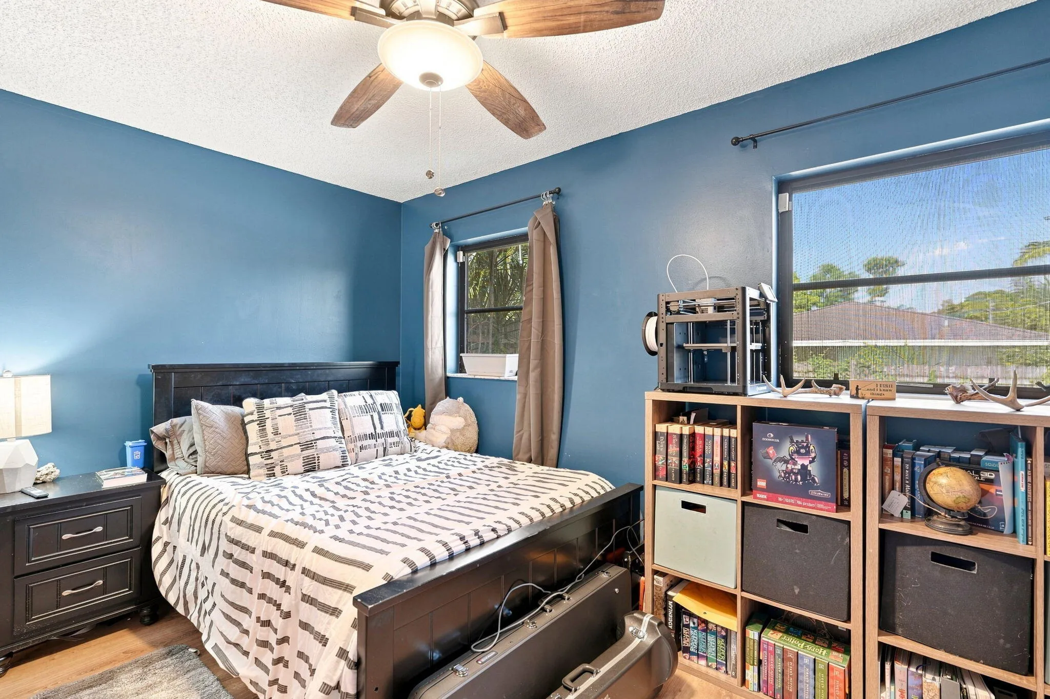 LVP flooring, ceiling fan with integrated lighting and dual windows