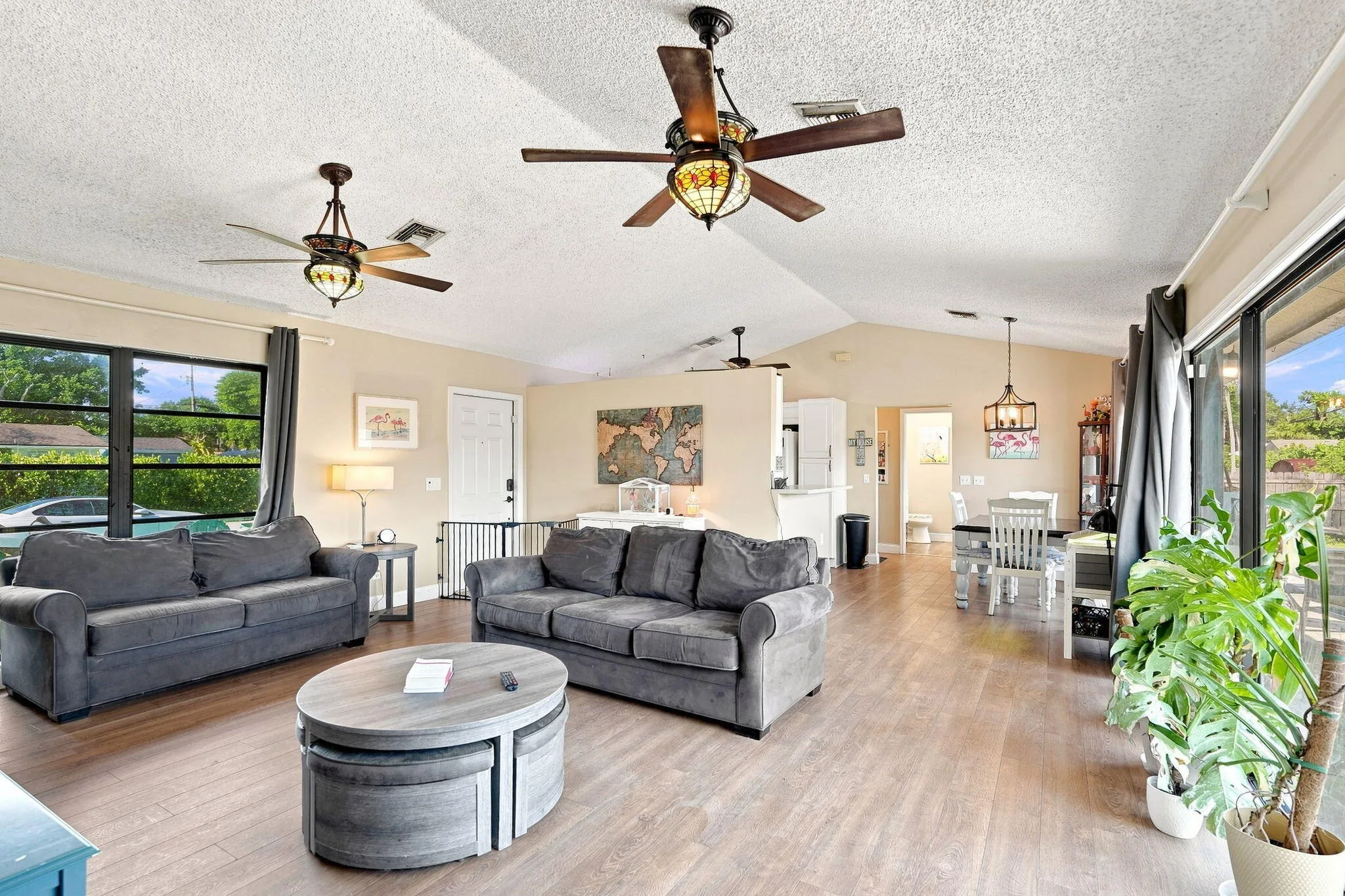 Vaulted ceilings, LVP flooring and multiple ceiling fans