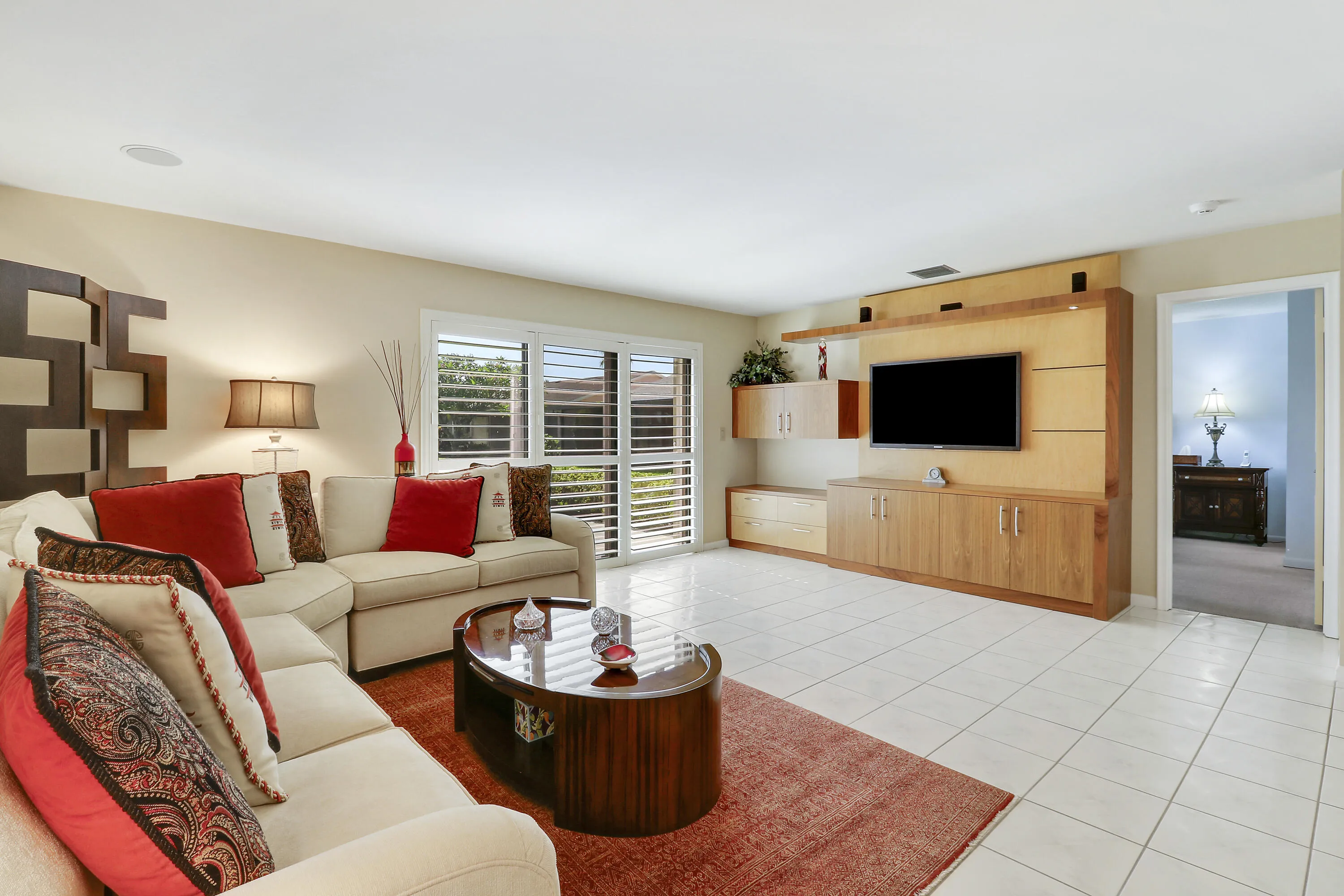 The living area features a build in entertainment center.