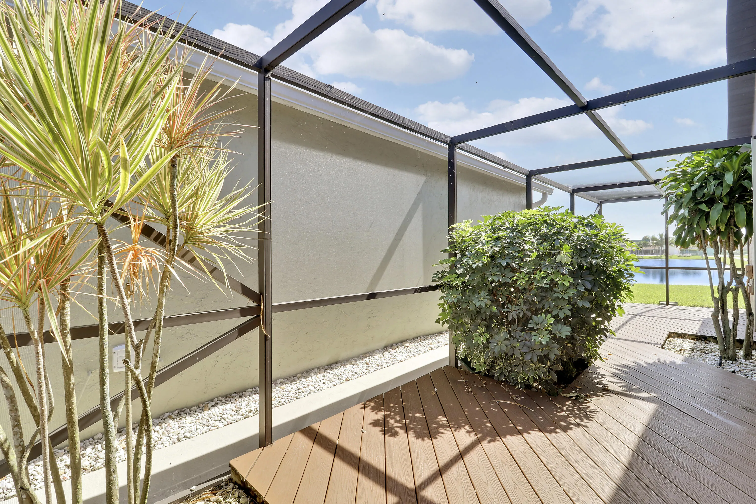 Access the fully screened, side lanai from the kitchen for al fresco dining.