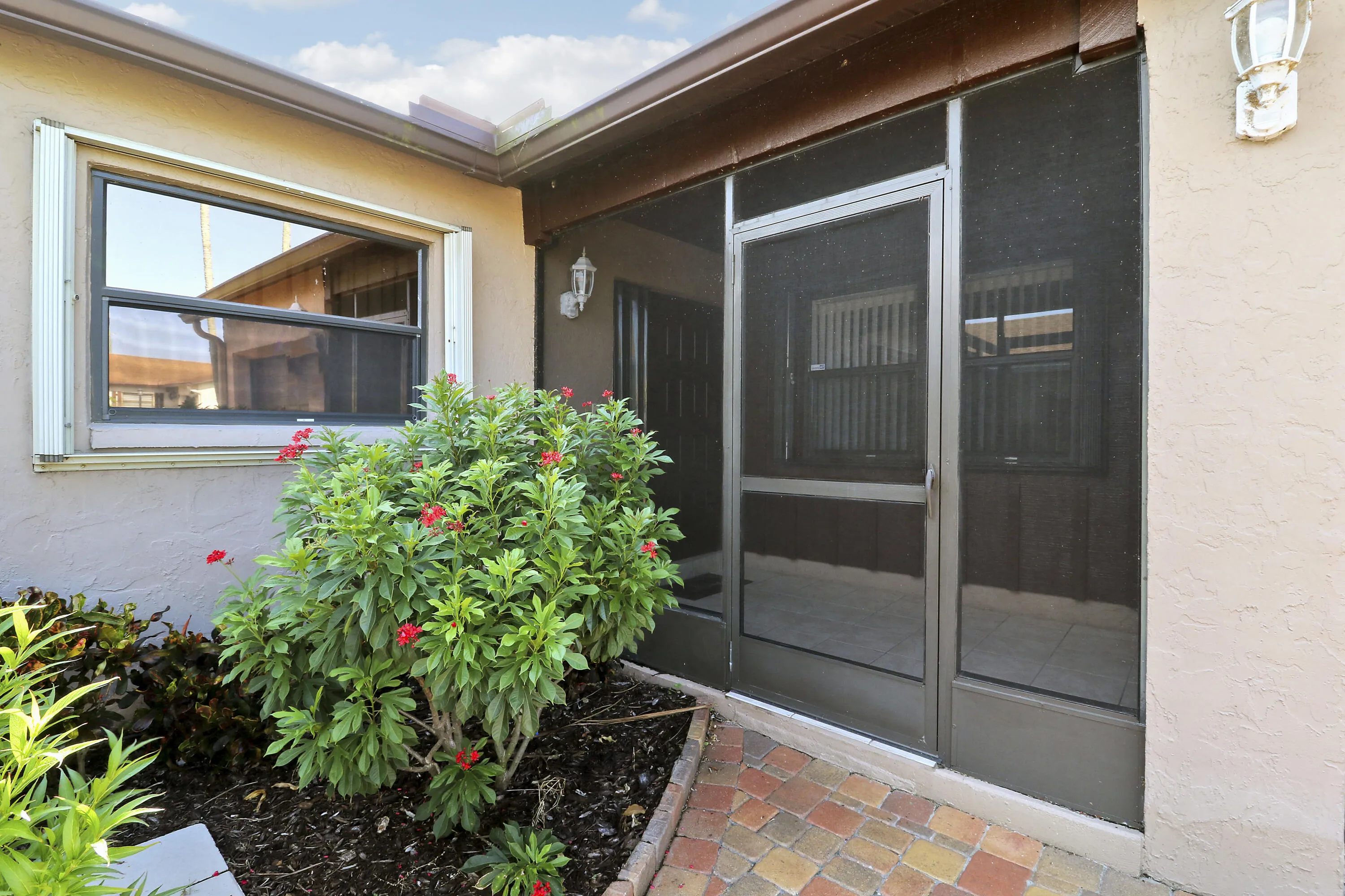 The front entrance is fully screened.