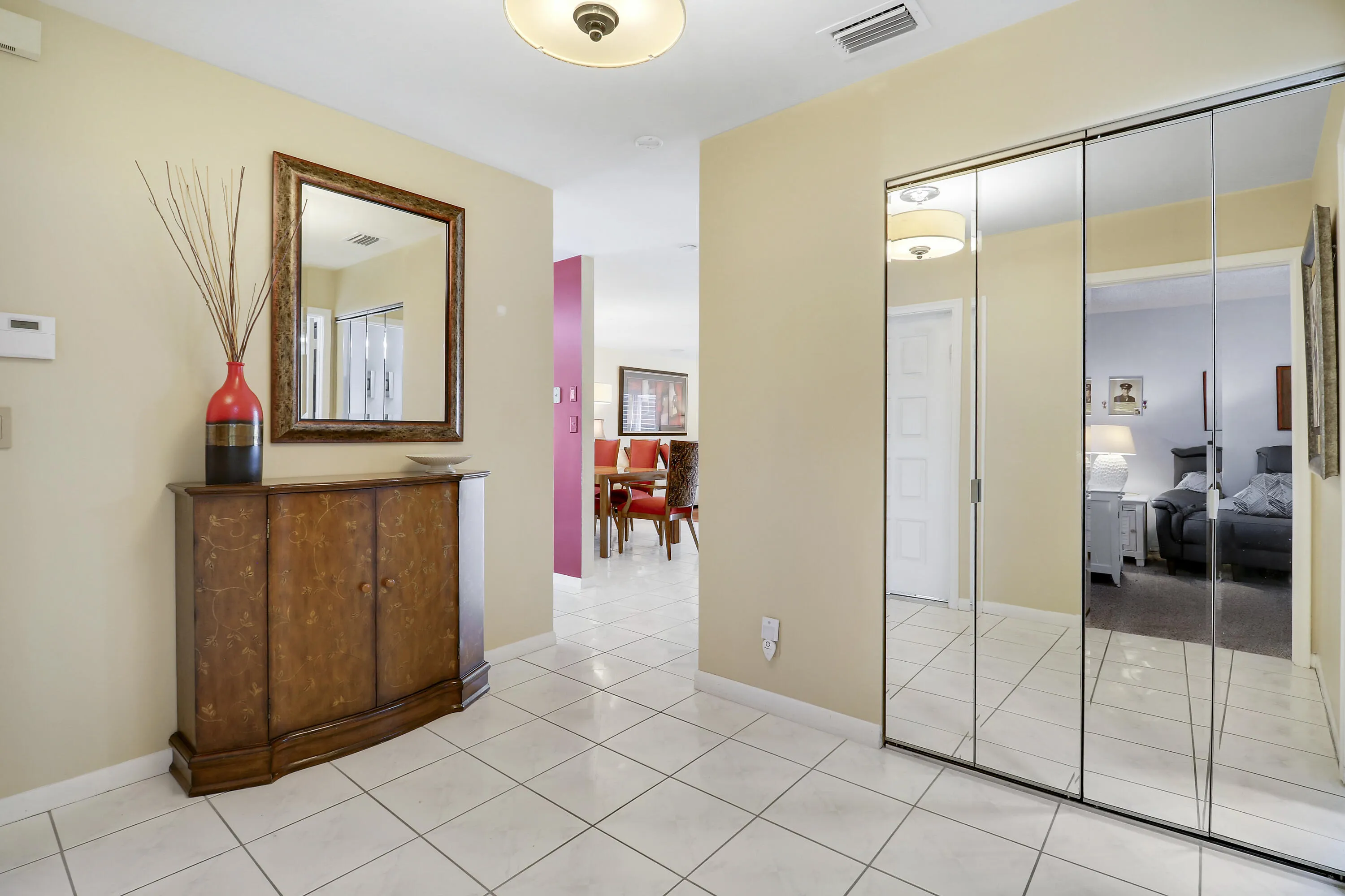 From the foyer, the guest bedroom and bath are to your right. The kitchen is to your left and the main living area is straight ahead.