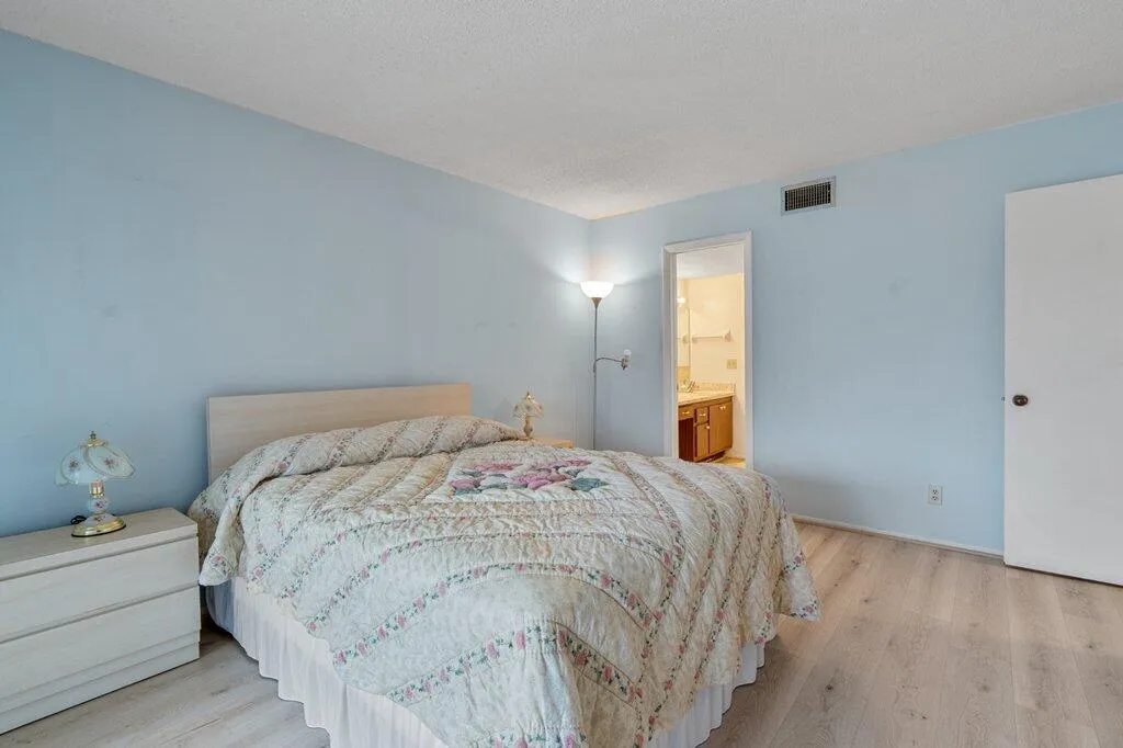 Light wood-like finish LVP flooring with a neutral wall color
