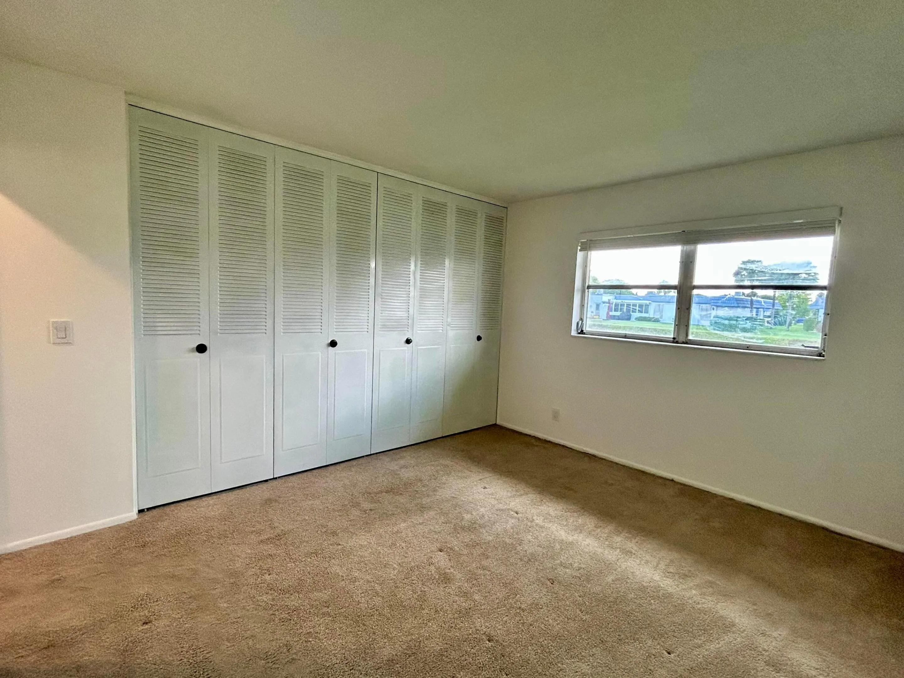 bedroom with wall-to-wall closet