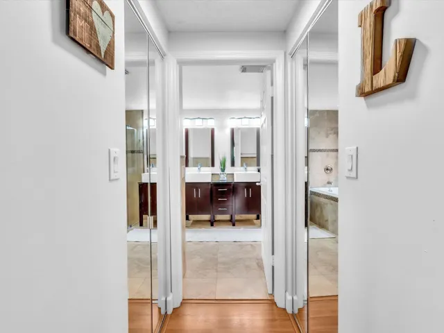 His and Her closets walking into the primary bathroom