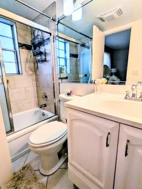 White vanity with cabinet storage, integrated sink, and chrome fixtures