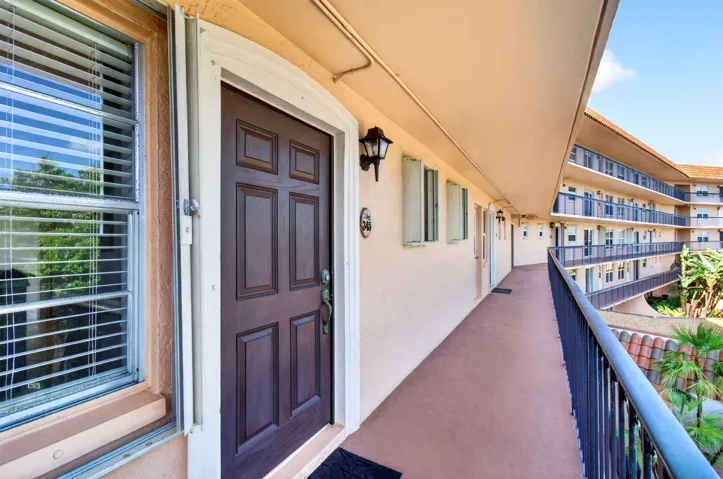 Paneled entry door with decorative hardware