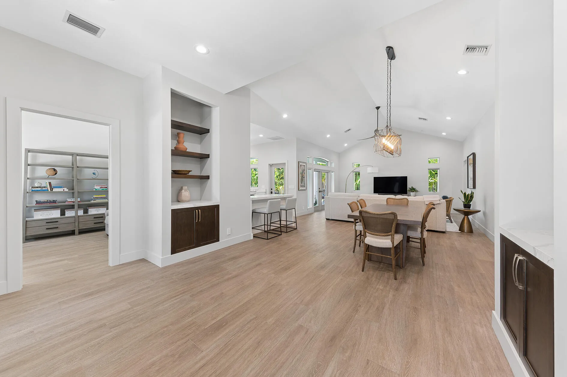 Generous Foyer Entrance with matching shelves and built-in cabinetry