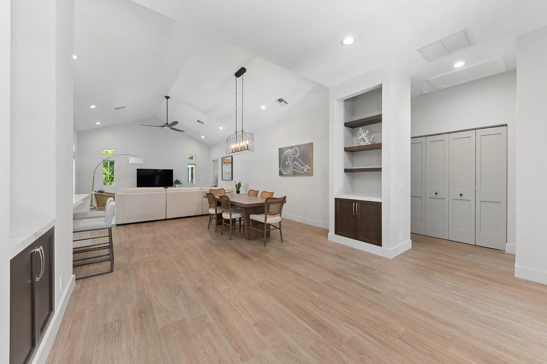 Generous Foyer Entrance with matching shelves and built-in cabinetry