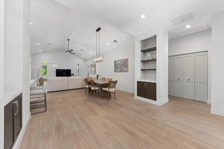 Generous Foyer Entrance with matching shelves and built-in cabinetry