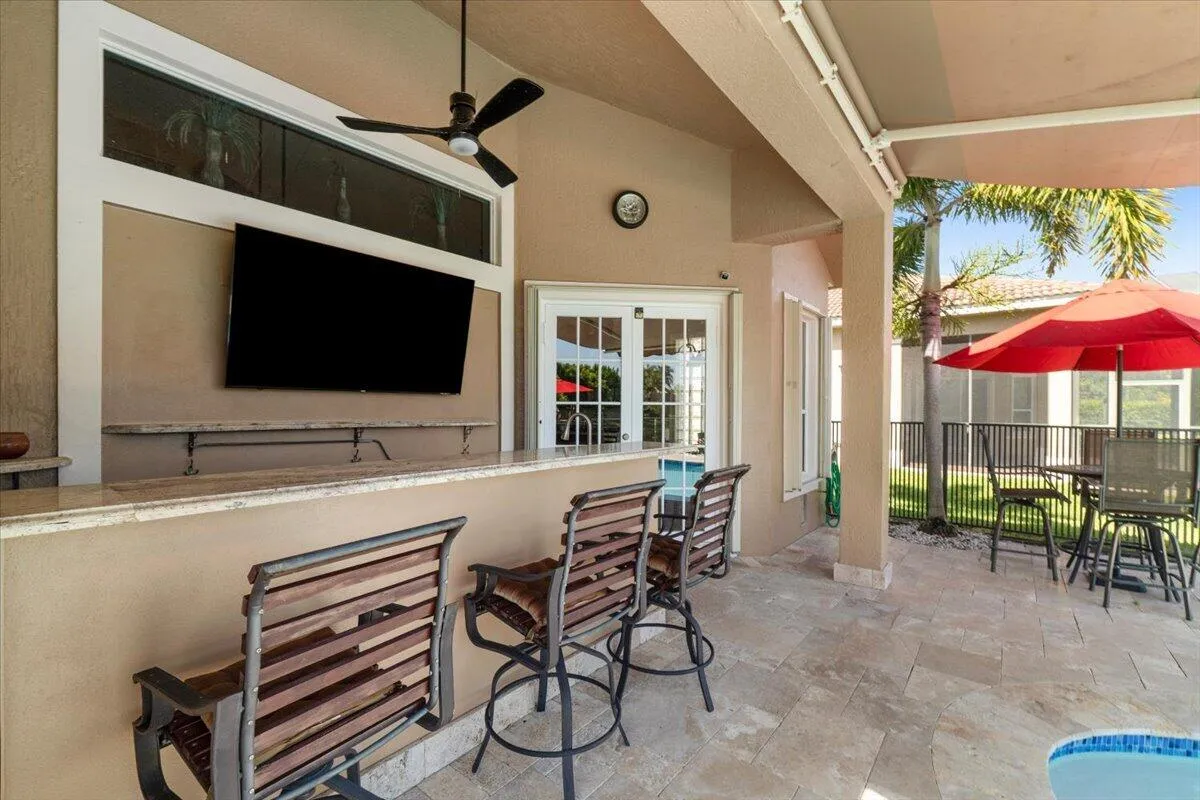 The outside bar area TV is also included and great for watching the game while grilling or having a beer of cocktail at the bar, Bar stools included as well as all pretty patio furniture as seen