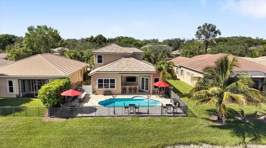 The back patio is fully fenced with 2 gates, New Pool, Jerusalem Travertine pavers, built in summer kitchen and built in outside bar & Hibachi grill, Outdoor cobblestone lighting, perfect for family BBQ's & Cocktail parties