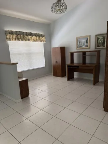 Separate dining room currently being used for an office