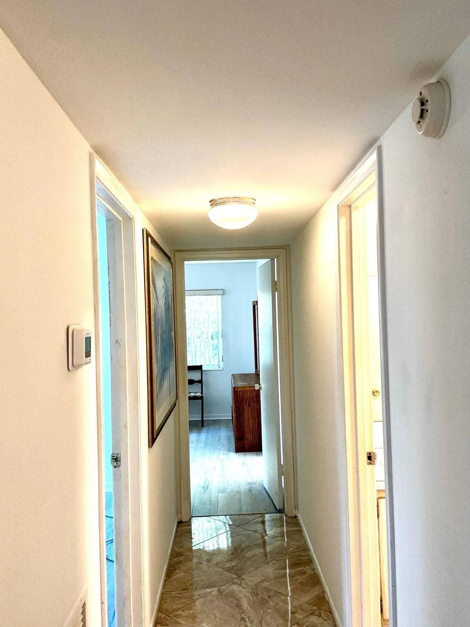Polished floor tiling throughout the hallway