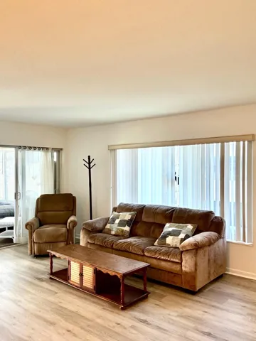 Wood-finish flooring throughout the room