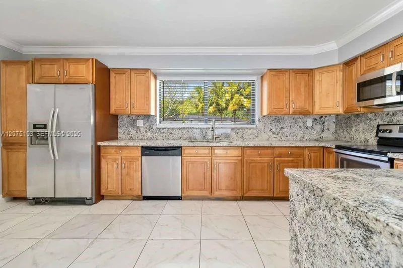 Enjoy a huge marble counter top that was custom made for a conversation starter
