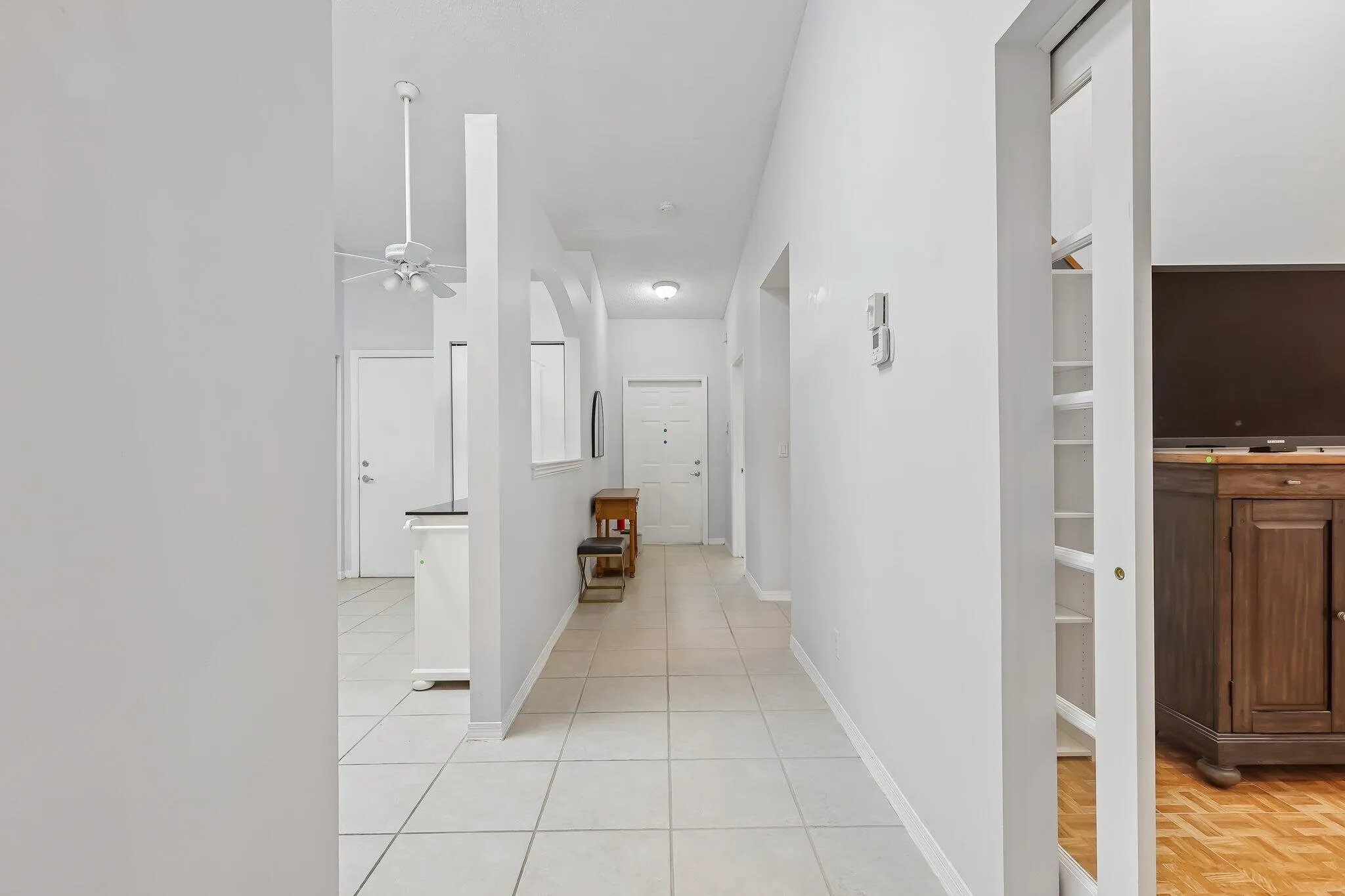 Tile flooring throughout the hallway