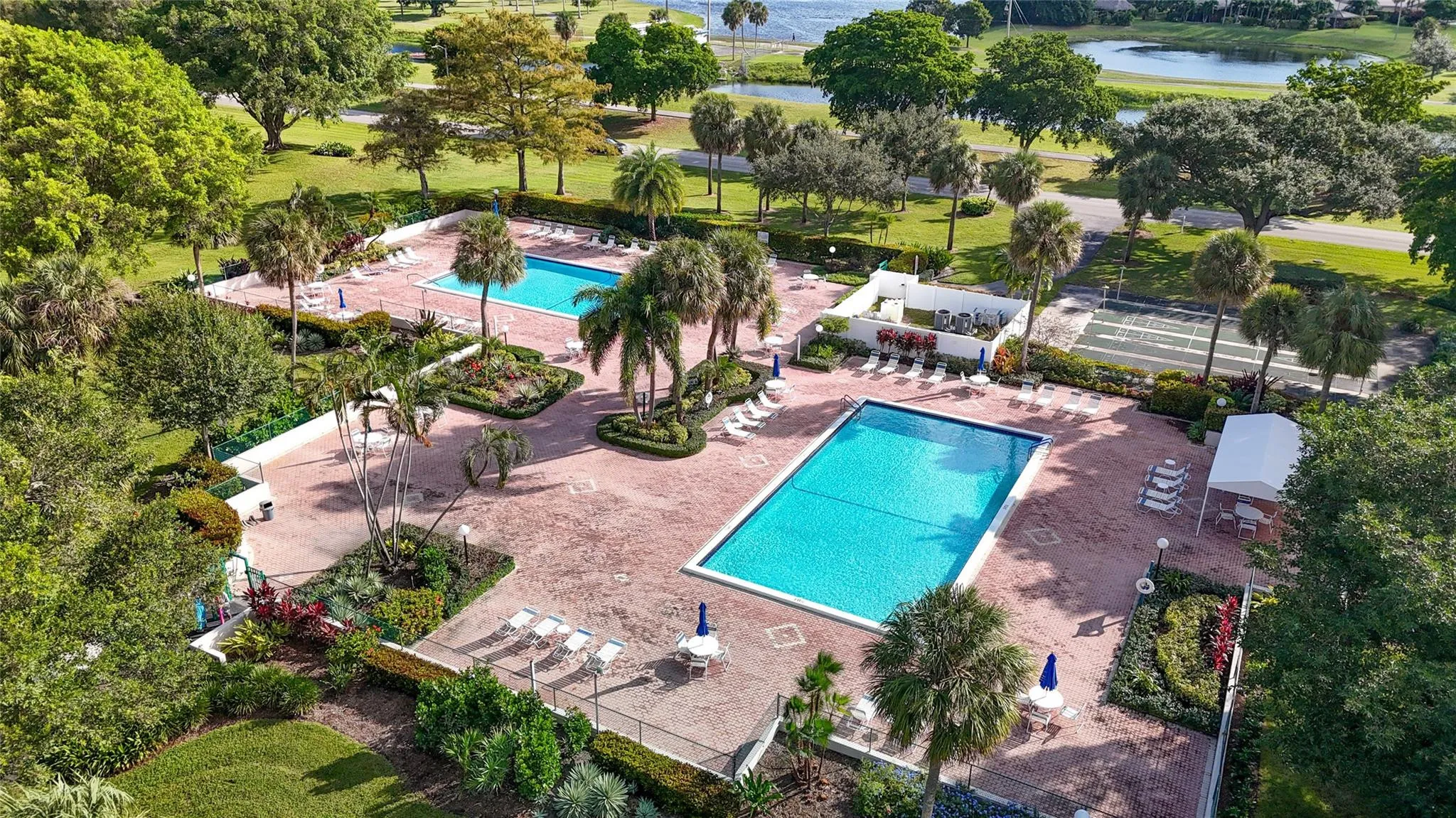 2 pools (one heated) surrounded by lushious landscaping