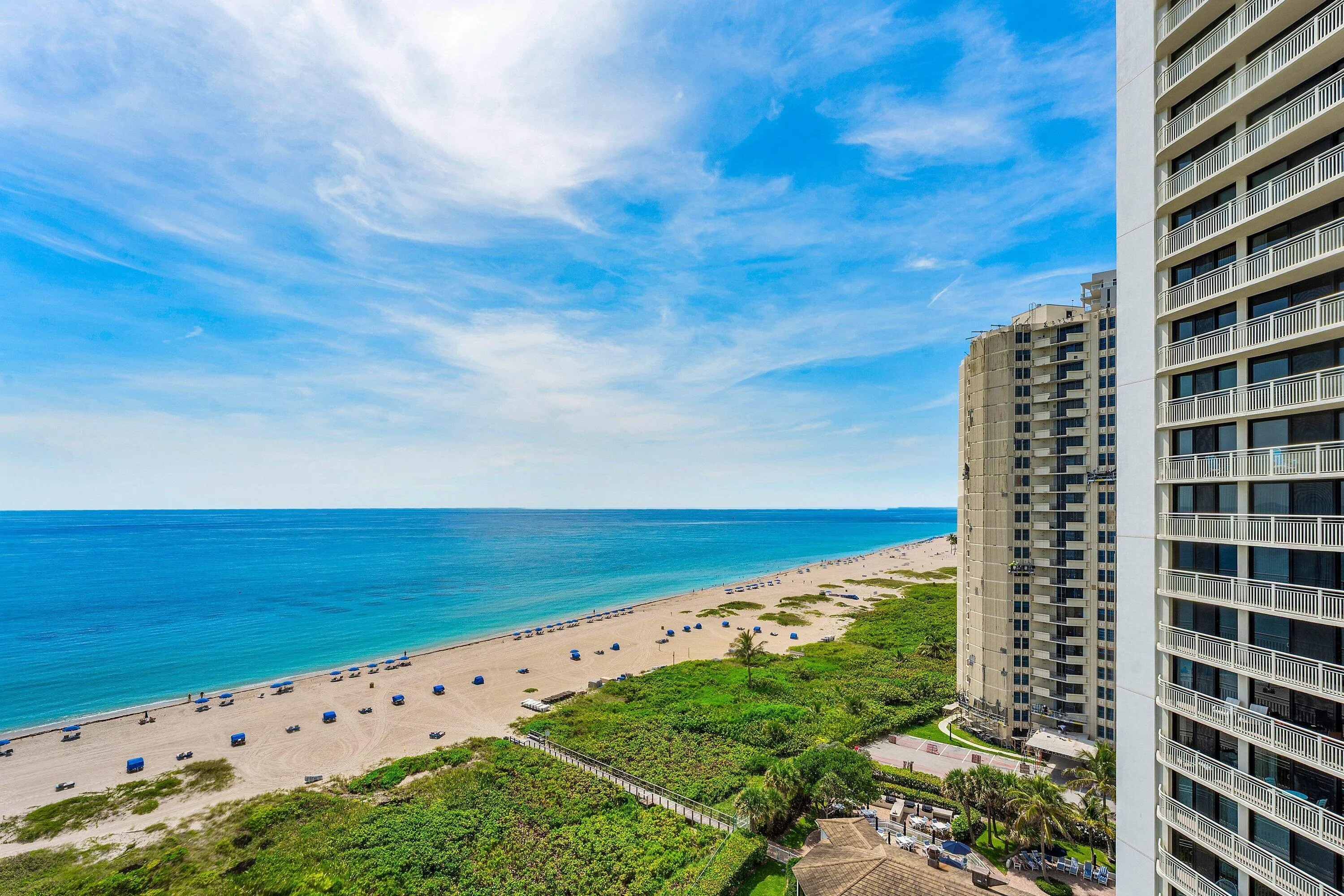 Unobstructed Atlantic Ocean and beach views stretch along the Singer Island shoreline.