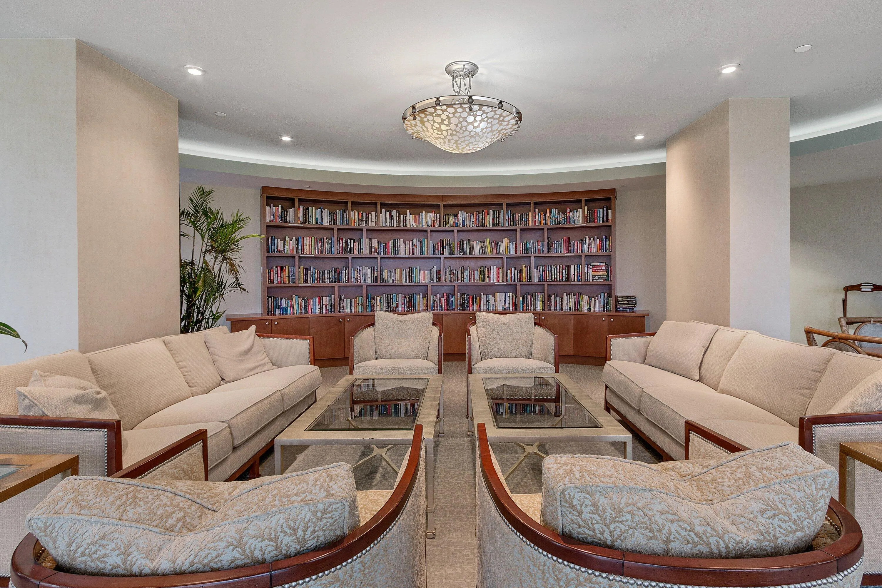 Tiara's library provides built-in book storage and comfortable conversation seating in a quieter community setting.