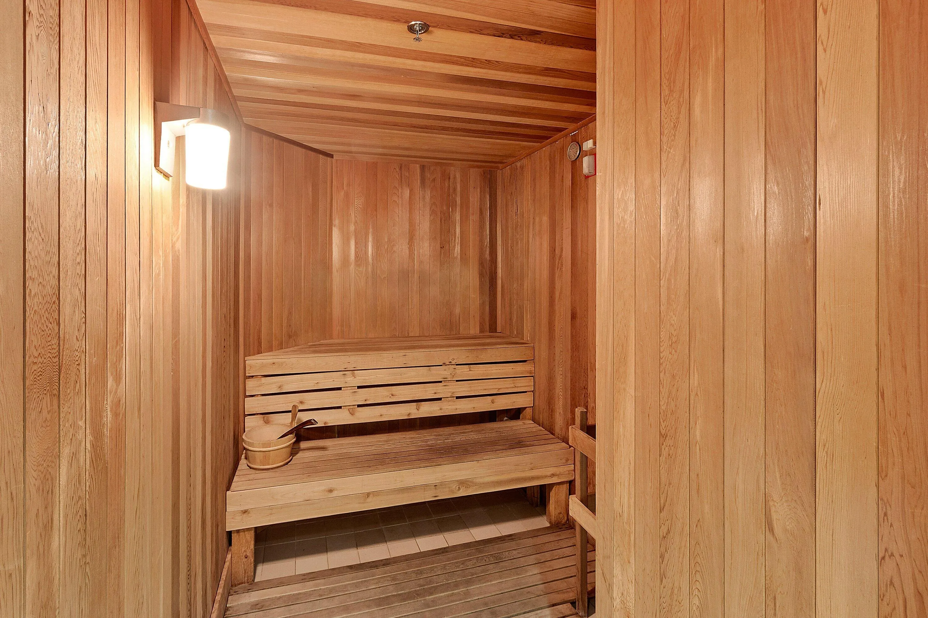 The wood-lined sauna adds another wellness amenity within the Tiara community.